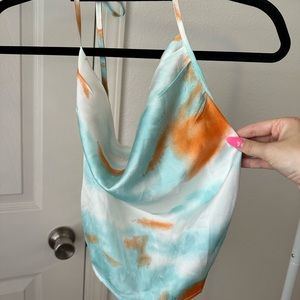 Blue, orange, and white backless top